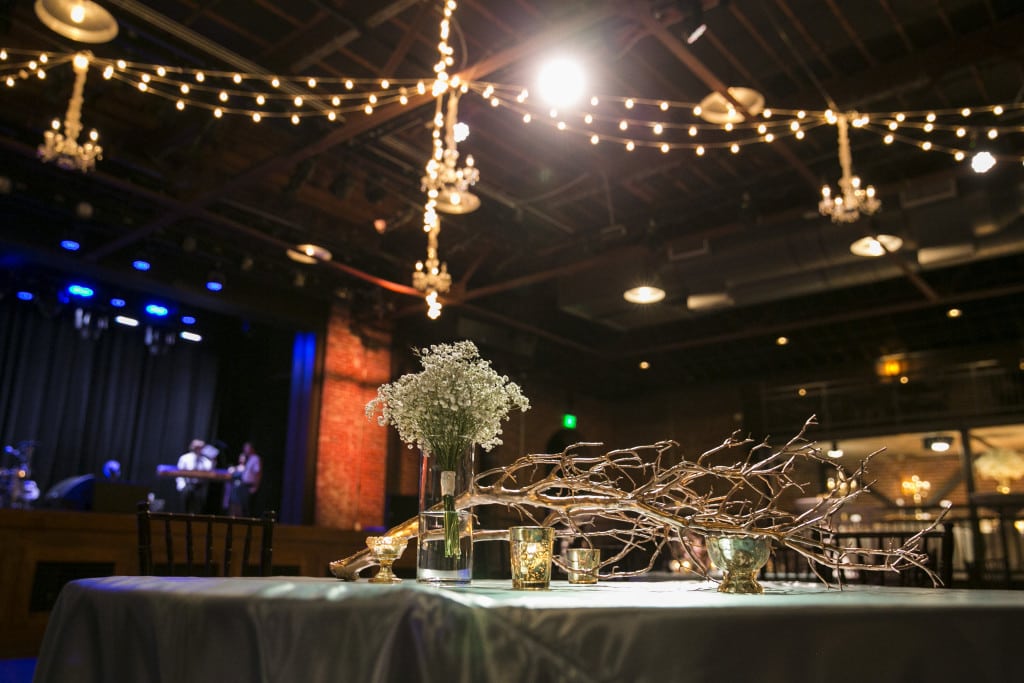 Light Blue Satin linens, gold accents and string lights David Bley Images